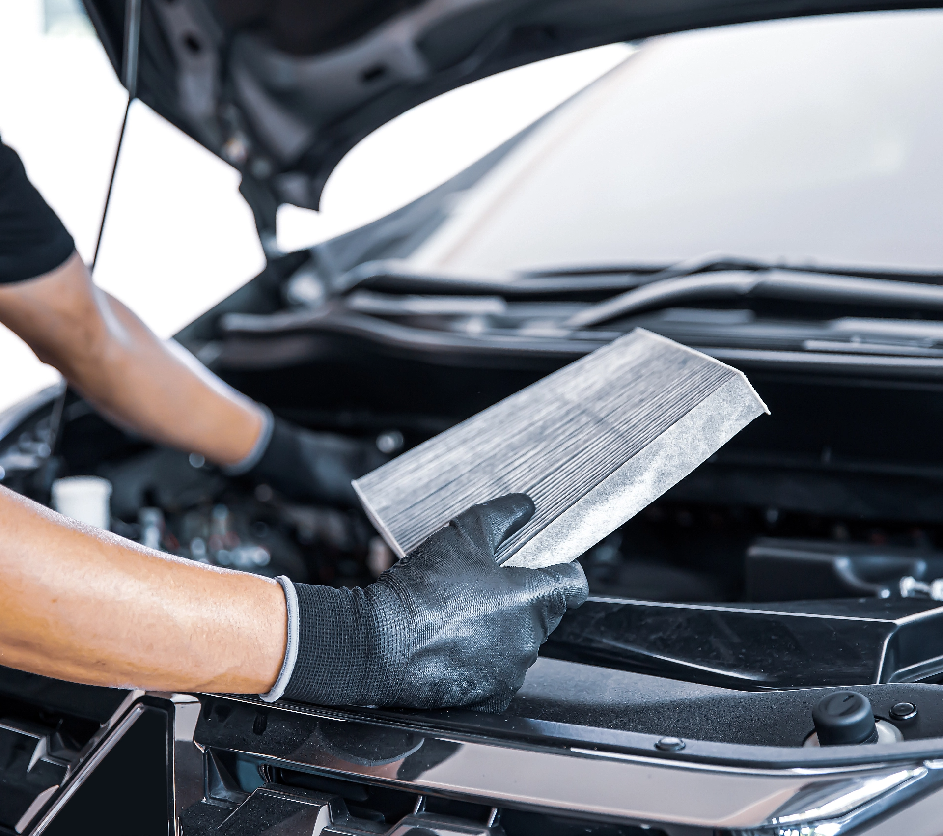 Customer discussing logbook service benefits with an independent mechanic in Caloundra