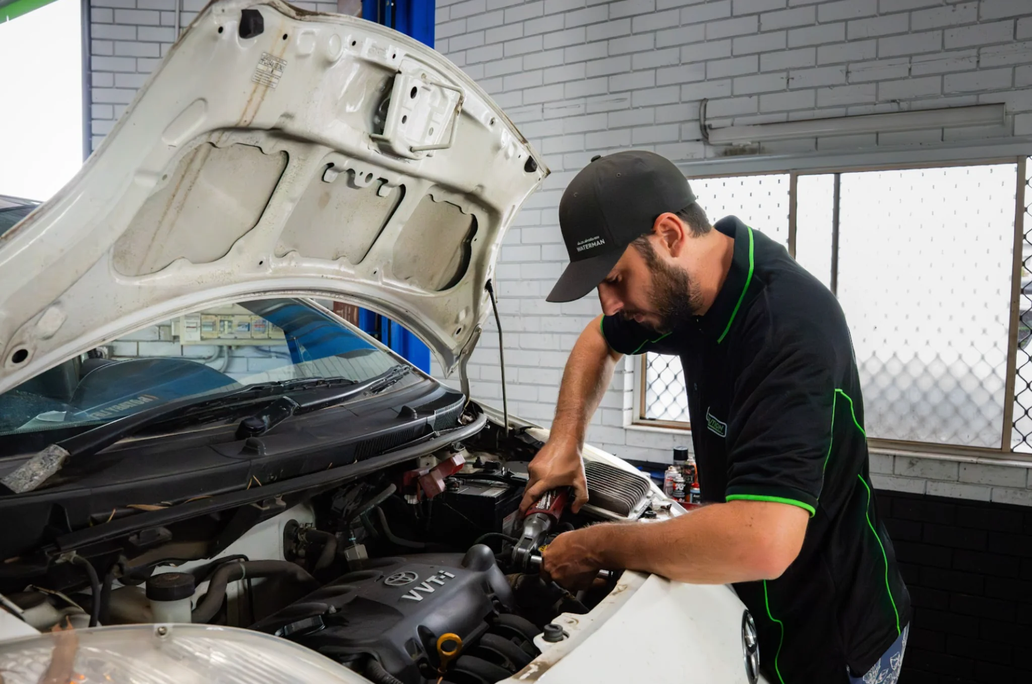 Revolution Autocare technician working on a diesel vehicle in the Caloundra workshop